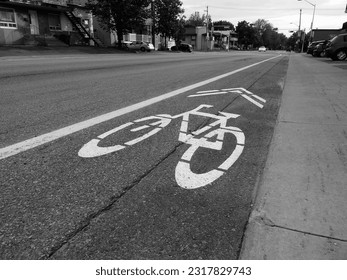 Bicycle sign on the road in black and white. Bike lane.
