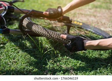 Bicycle tires leak, Cyclists are checking bicycle wheels, Close-up - Powered by Shutterstock