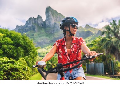 Bicycle Tourism Woman Tourist Biking On E-bike Rental In Bora Bora, Island, Tahiti, French Polynesia. Active Sport Travel On Summer Vacations. Adventure Fun Cyclist On Bike.