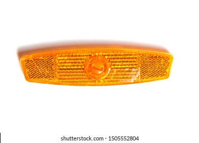 Bicycle Wheel Reflector Isolated On White Background. Orange Plastic Reflector Which Is Mounted On A Bike Spoke For Safety At Night