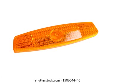 Bicycle Wheel Reflector Isolated On White Background. Orange Plastic Reflector Which Is Mounted On A Bike Spoke For Safety At Night