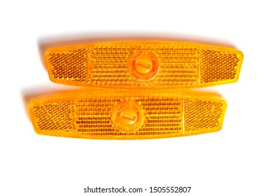 Bicycle Wheel Reflectors Isolated On White Background. Two Orange Plastic Reflectors For A Bike Spoke For Safety At Night