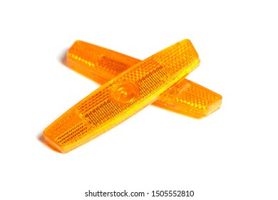 Bicycle Wheel Reflectors Isolated On White Background. Two Orange Plastic Reflectors For A Bike Spoke For Safety At Night