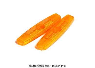 Bicycle Wheel Reflectors Isolated On White Background. Two Orange Plastic Reflectors For A Bike Spoke For Safety At Night