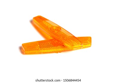 Bicycle Wheel Reflectors Isolated On White Background. Two Orange Plastic Reflectors For A Bike Spoke For Safety At Night