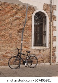 
Bicycle, window, pole.
