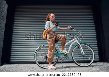 Bicycle, woman and phone in city feeling excited and happy about message while outdoor in summer with trendy look. Eco friendly transportation for carbon footprint female on a bike using 5g network
