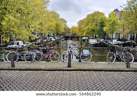 Similar – Foto Bild Architektur niederländischer Häuser Fassade und Hausboote am Amsterdamer Kanal