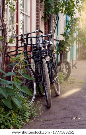 Similar – Fahrräder in der Nähe von niederländischen Häusern in Amsterdam City