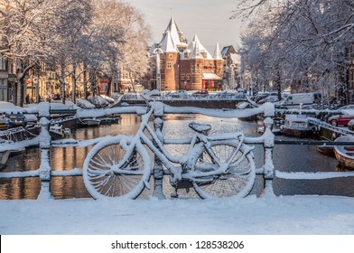 Bicycles under the Snow, view on Nieuwmarkt, Amsterdam Channels