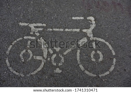 Similar – richtungsweisend | Straßenmarkierung Moped-Parkplatz