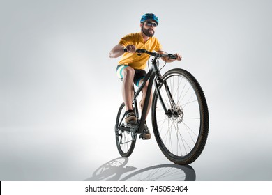 The Bicyclist On Gray, Studio Shot.