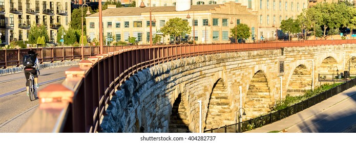 Bicyclist On An Urban Trail Bridge