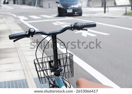 Bicyclists on sidewalks approach intersections with crosswalks. Japanese Roads and Traffic Rules