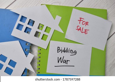 Bidding War And House For Sale Write On Sticky Notes Isolated On Office Desk