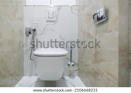 bidet in modern toilet with  wall mount shower attachment
