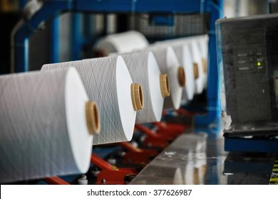 Biella, Italy - Circa May 2014: Industrial Textile Production Of Coloured Polyester Threads And Yarns