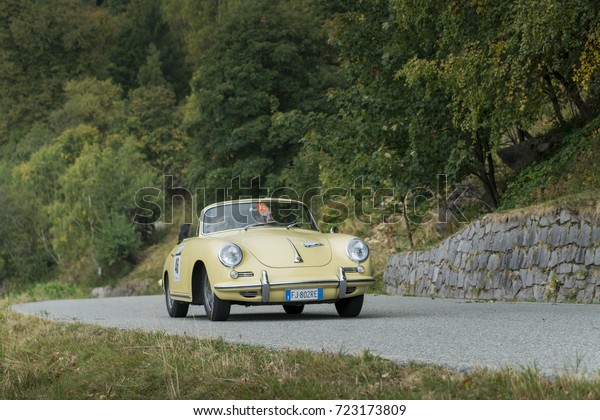 BIELLA / ITALY - SEPTEMBER 24, 2017:\
Vintage car running on country road: a Porsche 356 C during a\
meeting of historic cars. This model was built in\
1965.