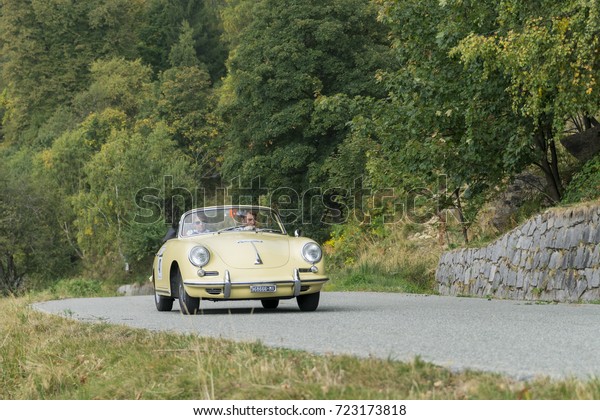 BIELLA / ITALY - SEPTEMBER 24, 2017:\
Vintage car running on country road: a Porsche 356 C during a\
meeting of historic cars. This model was built in\
1965.