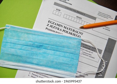 
Bielsko, Poland - 05.01.2021: Protective Mask And Graduation Sheet. Writing Baccalaureate During A Pandemic. Mandatory Equipment For High School Graduates Consisting Of A Protective Mask And A Pen. 