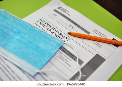 
Bielsko, Poland - 05.01.2021: Protective Mask And Graduation Sheet. Writing Baccalaureate During A Pandemic. Mandatory Equipment For High School Graduates Consisting Of A Protective Mask And A Pen. 