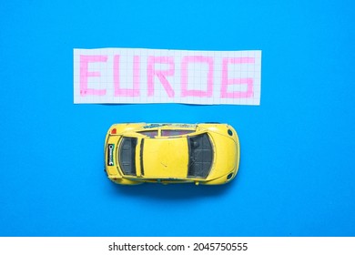 Bielsko, Poland - 09.22.2021: Top View Of The Car And A Card With The Word Euro 6. Concept Showing The European Emission Standard Euro 6. Introducing Restrictive Emission Standards. 