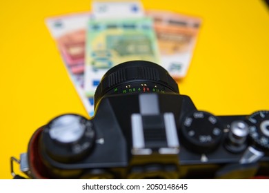 Bielsko, Poland - 09.30.2021: Euro Currency Next To Vintage Camera. Concept Showing Earning Money From Photography. Creative Work