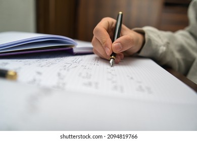 Bielsko, Poland - 12.21.2021: High School Student Is Preparing For The Exam. Remote Learning At Home Due To Coronavirus. Self-preparation For A Math Test