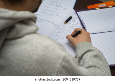 Bielsko, Poland - 12.21.2021: High School Student Is Preparing For The Exam. Remote Learning At Home Due To Coronavirus. Self-preparation For A Math Test