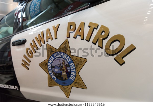 Bielsko-Biala, Poland - July 15, 2018:\
California Highway Patrol sign on a vintage US police\
car.
