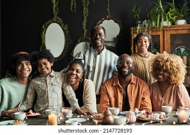 Big African family at dining table - Powered by Shutterstock