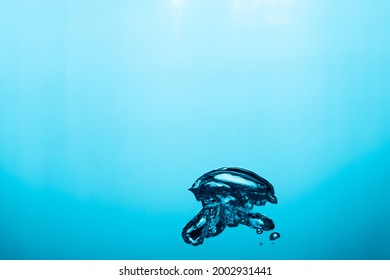 Big Air Bubble Are Rising In The Blue Water , Air Bubble Isolated On 
Blue Background.
