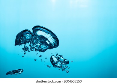 Big Air Bubble Are Rising In The Blue Water , Air Bubble Isolated On 
Blue Background.
