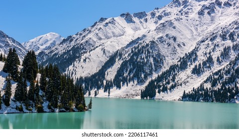 Big Almaty Lake on an autumn day after the first snowfall - Shutterstock ID 2206117461