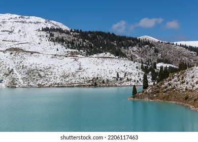 Big Almaty Lake on an autumn day after the first snowfall - Shutterstock ID 2206117463