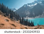 Big Almaty Lake in the Tien Shan mountains of Kazakhstan. Panorama of a beautiful mountain landscape on a sunny autumn day