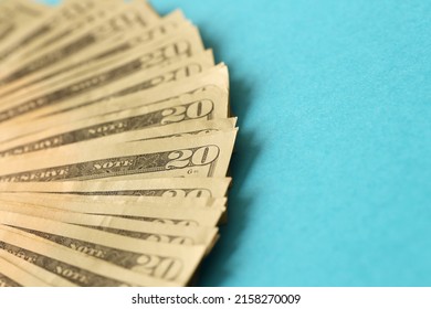 Big Amount Of Old Twenty Dollar Bills On Blue Background. Money Earnings, Payday Or Tax Paying Period Concept