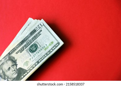 Big Amount Of Old Twenty Dollar Bills On Bright Red Background. Money Earnings, Payday Or Tax Paying Period Concept