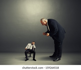 Big Angry Boss Screaming At Small Lazy Worker