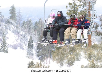 Big Bear California December 15, 2007:  Ski Patrons Rides Ski Lift Up And Down The Mountain For Skiing, And Snowboarding Recreation.