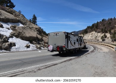 Big Bear, California, February 2, 2021: A Fifth 5th Wheel Recreational Travel Trailer On A Mountain Road Looking For Adventure And A Place To Camp