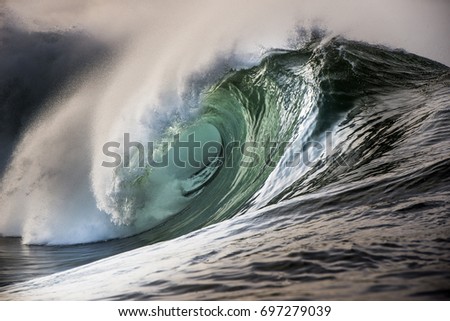 Big beautful perfect surfing waves barreling in the Atlantic Ocean.