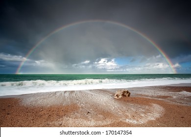 Big Beautiful Rainbow Over Ocean Waves After Storm