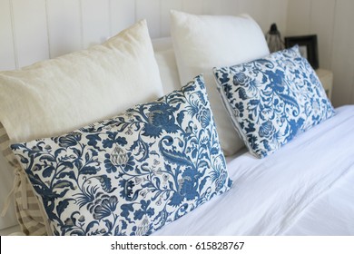 Big Bed In Country Farm House With White And Blue Cushions