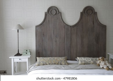 Big Bed With High Headboard In Gray Color