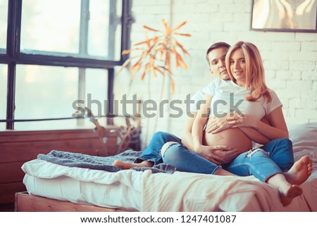 Similar – Image, Stock Photo Man and pregnant woman looking baby clothes