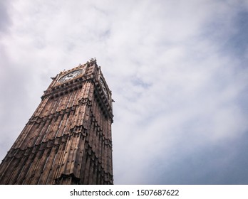 Big Ben Clock (diagonal angle) in cloudy sky from ground.	