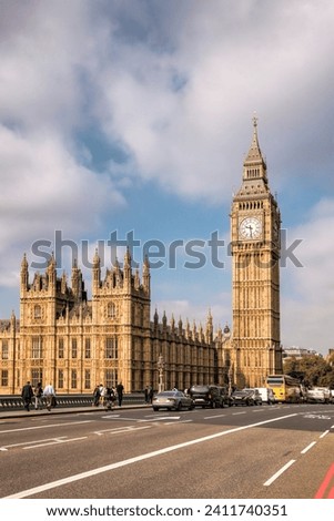 Big Ben during a sunny day with busy bridge in London, England, UK