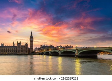 The Big Ben, the Houses of Parliament and Westminster bridge in London in a beautiful summer night, England, United Kingdom - Powered by Shutterstock