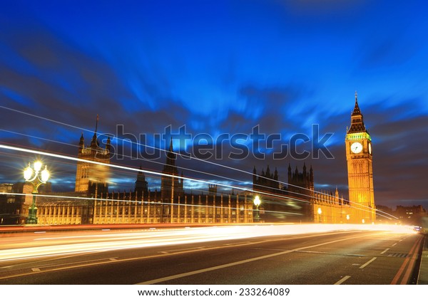 Big Ben\
and London at night with the lights of the cars passing by, the\
most prominent symbols of both London and\
England